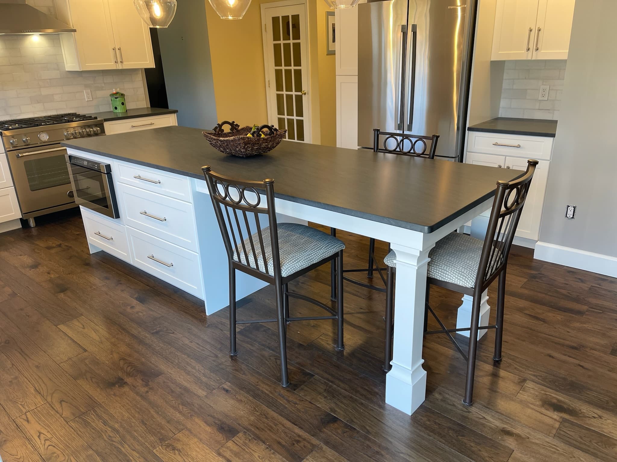 White island kitchen with dark countertop